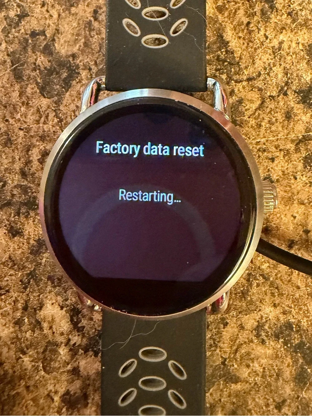Fossil Q Wander Smartwatch with silicone and silver metal band and charger
